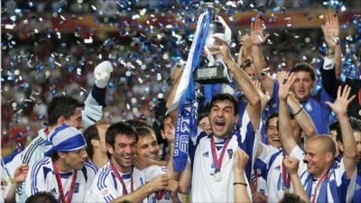 Traianos Dellas of Greece lifts the trophy