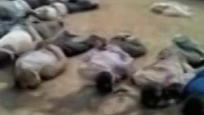 Footage which appears to show the bodies of men with their arms tied