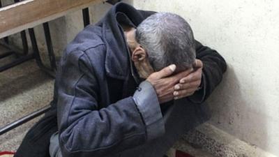 Man mourning in Syria