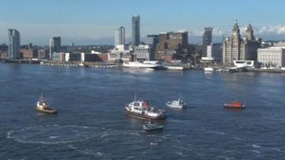 Olympic flame on the ferry across the Mersey