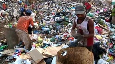 Workers on landfill site