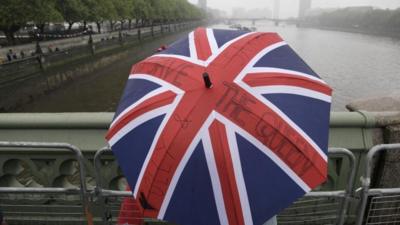 Crowds gather near River Thames despite rain