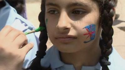 Girl's face being painted in Pakistan