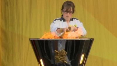 Torchbearer Louise Lyons lights the cauldron in Portrush