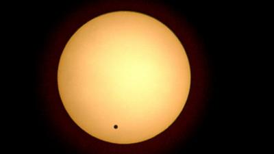 The planet Venus crosses the face of the Sun