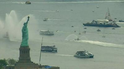 Statue of Liberty and Space Shuttle Enterprise on a barge