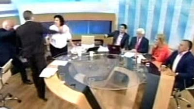 Golden Dawn spokesman Ilias Kasidiaris is seen slapping Syriza party member Rena Dorou on live TV