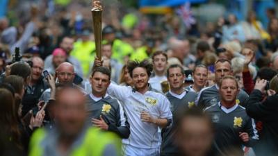 James McAvoy carries the Olympic flame