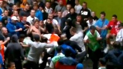 Scuffle between fans and stewards