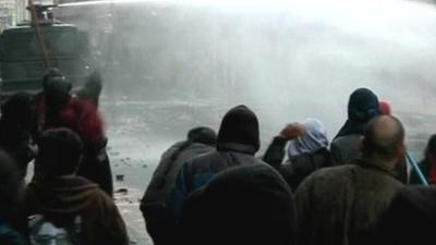 Water cannon being used by police