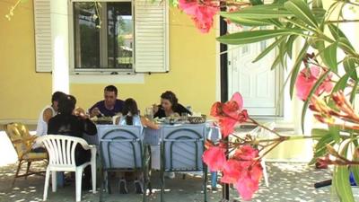 Greek family at dining table