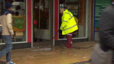 A man cleaning the street