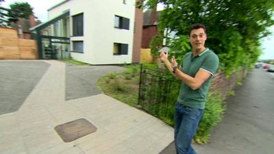 Joe outside an eco-home