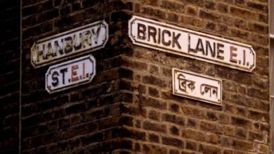 A street sign for Brick Lane