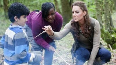 Duchess of Cambridge speaks to young people during a visit to the "Expanding Horizons" Primary School Project