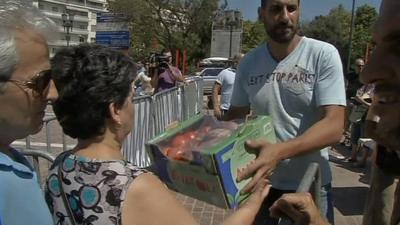 Greek woman receives free vegetable package