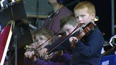 Children playing violins