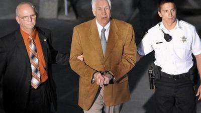 Jerry Sandusky leaves court in handcuffs