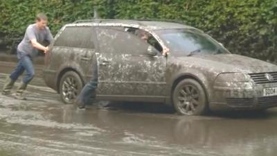 Car stranded in mud