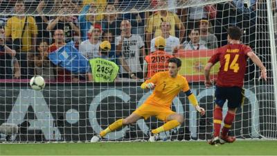 Xabi Alonso's penalty seals Spain's 2-0 win