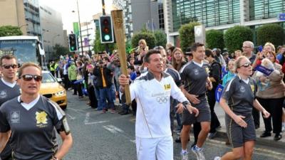 Lord Coe carries Olympic torch