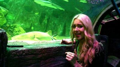 Hayley next to a shark