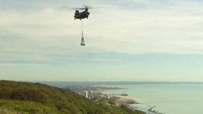 Granite memorial being airlifted