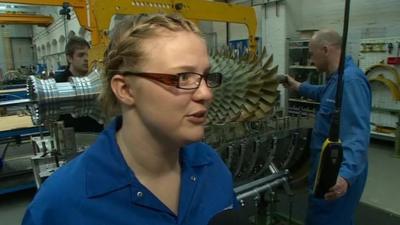 Girl working at engine plant