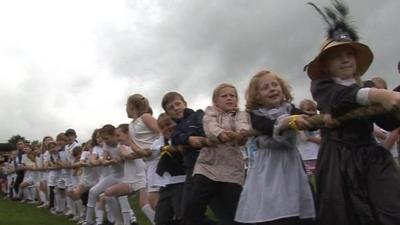 Children playing tug-of-war