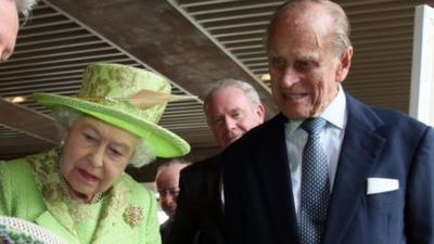 Queen, Duke of Edinburgh and Martin McGuinness in background