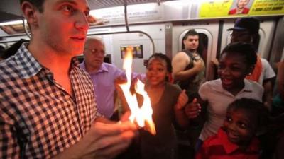 Man with fire on subway