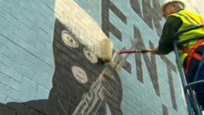 Mural being painted over in Belfast