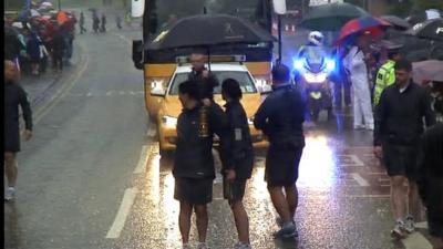 Olympic torch staff halt the relay due to lightning