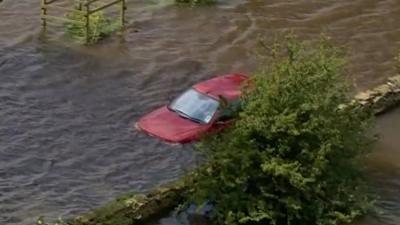 Car immersed in floodwater