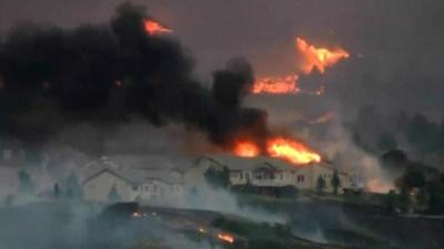 Fire threatens homes