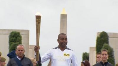 Corporal Johnson Beharry carrying the Olympic flame