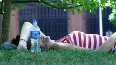 Woman swelters in the heat