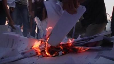 Ballot papers burning