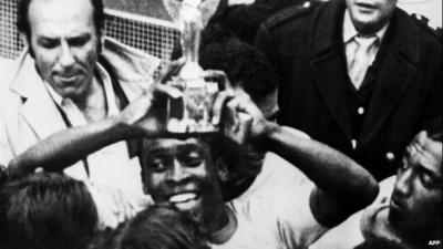 Brazil's Pele holds the World Cup in 1970