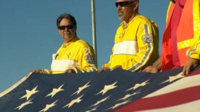 A flag is held up at a racecourse in Stockton, California