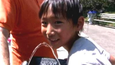 Boy and water fountain