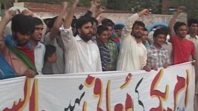 People in Pakistan protesting over the reopening of the NATO supply route to Afghanistan