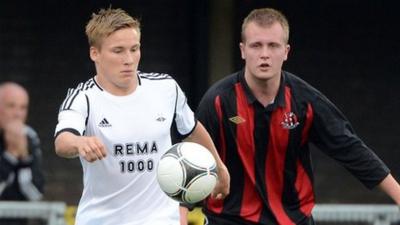 Rosenborg's Jonas Svensson in action against Jordan Owens of Crusaders