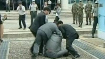 Security agents arrest the South Korean activist