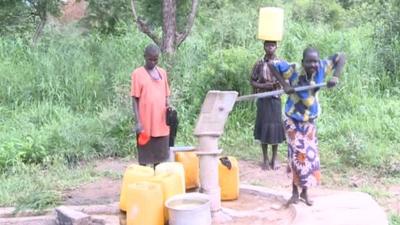 Villagers at water pump