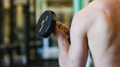 Anonymous man working out in the gym