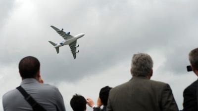 A Malaysian Airlines Airbus A380 takes part in a flying display at the Farnborough International Airshow.