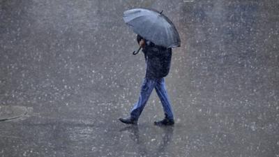 man walking with an umbrella