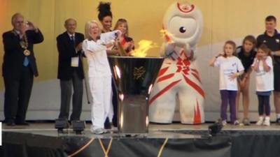 Caroline 'Dolly' Burnett lights the Olympic cauldron in Salisbury