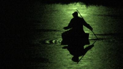 Coracle fishing by night